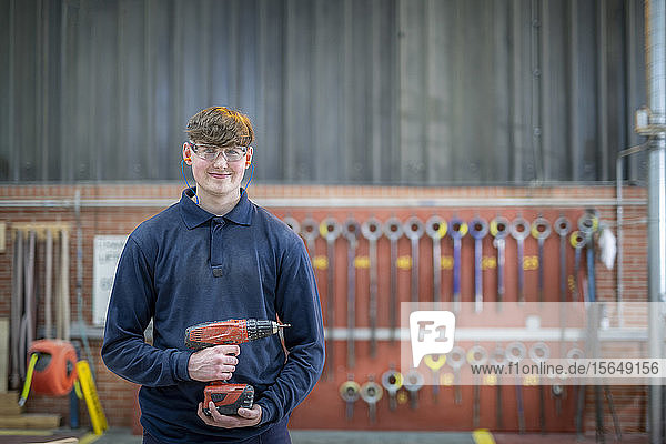 Portrait of apprentice timber mould maker in steelworks