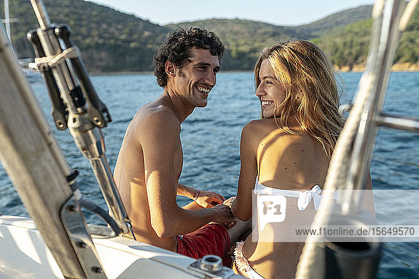Affectionate couple on sailboat Italy