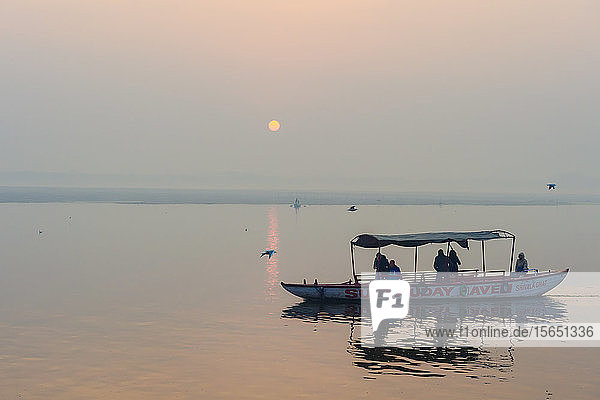 Small boats on Ganges River at sunset  Varanasi  Uttar Pradesh  India