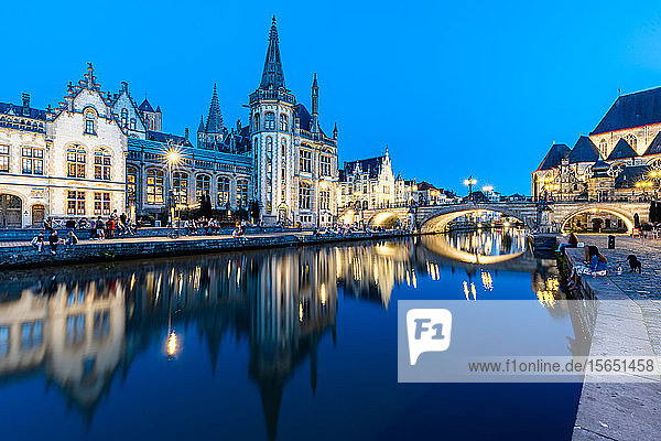 Graslei Quay in the historic city center of Ghent  mirrored in the River Lys during blue hour  Ghent  Belgium