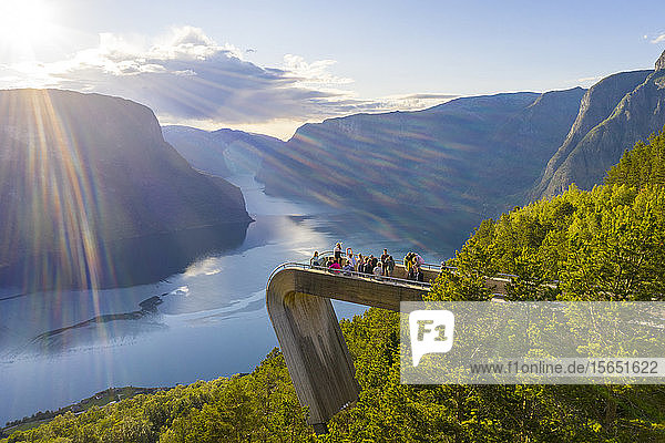 Tourists admiring the fjord from Stegastein viewpoint  Aurlandsvangen  Sognefjord  Norway  Scandinavia