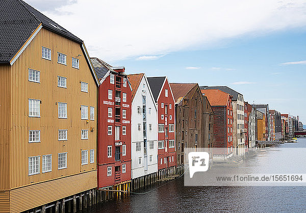 Old wooden warehouses on the Nidelva River in Trondheim Trondelag Norway Scandinavia