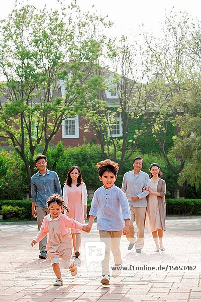 Happy family in the neighborhood for a walk