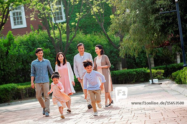 Happy family in the neighborhood for a walk
