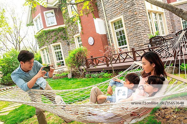 Happy family photographs in the yard