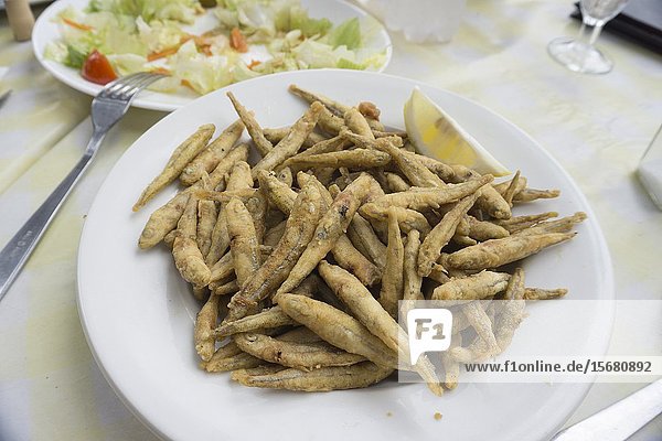 Plate of fresh little anchovies fried called Peixet fregit in Catalan.