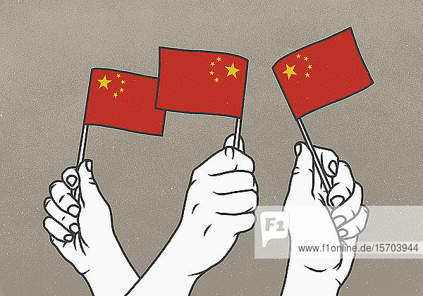 Hände  die kleine chinesische Flaggen schwenken