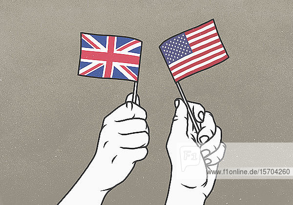 Die Hände schwenken kleine britische und amerikanische Flaggen