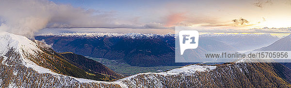 Sunset on the autumnal landscape of Scermendone Alp and Orobie Alps aerial view by drone Rhaetian Alps Valtellina Lombardy Italy Europe
