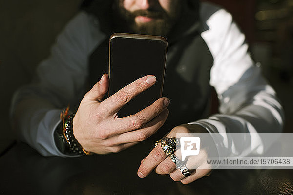 Man's hands with smartphone