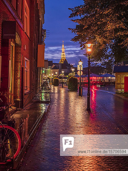 City view at dusk with illuminated tower of the townhall  Zierikzee  Netherlands
