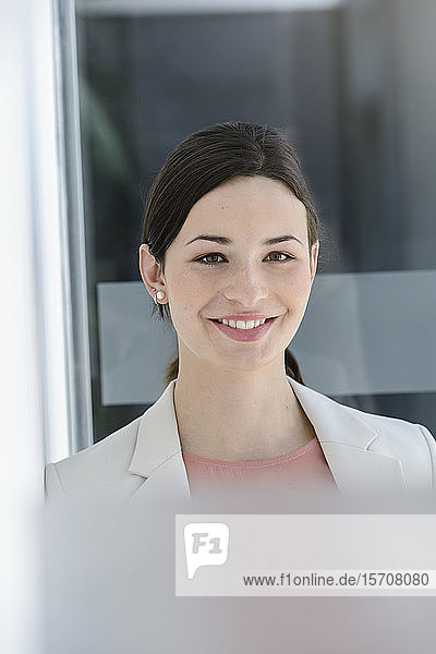 Portrait of smiling young businesswoman in office