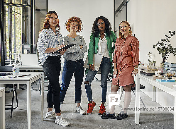 Portrait of confident female business team in office