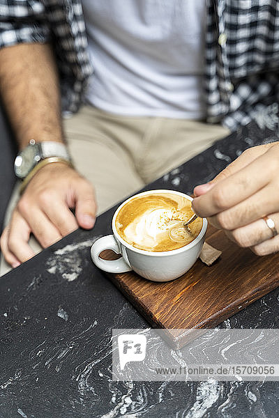 Man enjoying cup of Cappuccino  close-up