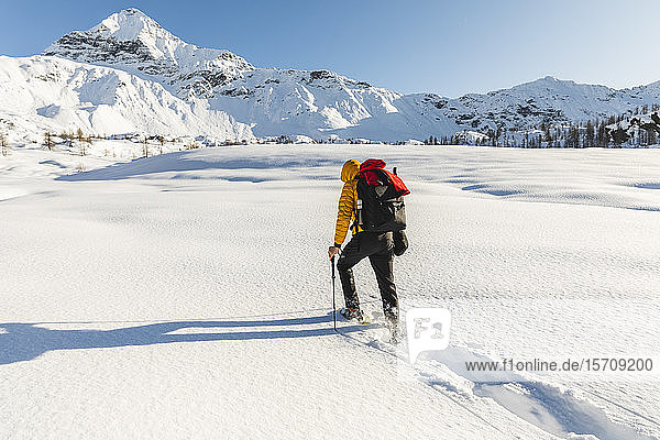 Hiking with snowshoes in the mountains  Valmalenco  Sondrio  Italy