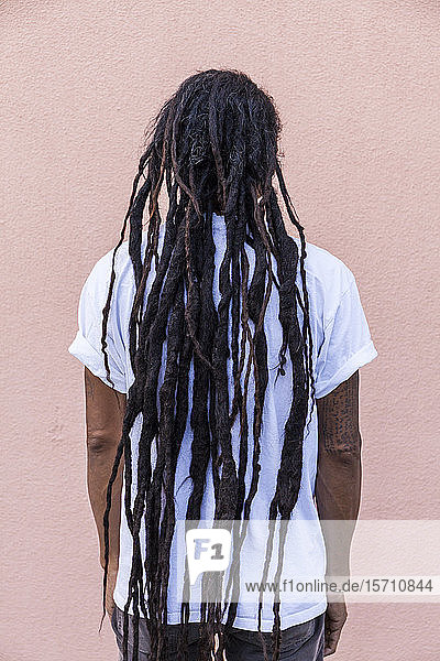Rear view of mature man with dreadlocks