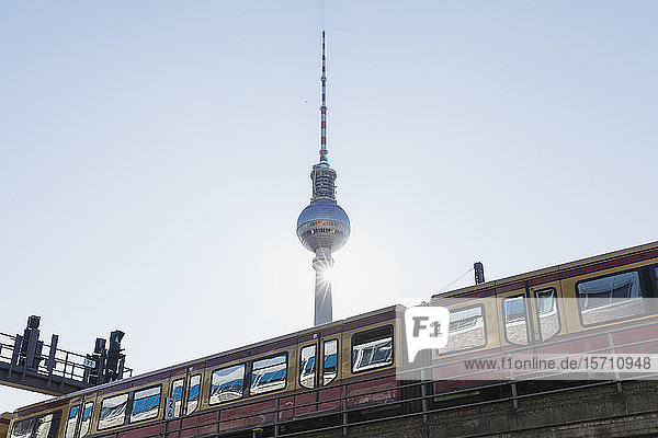 Germany Berlin Low angle view of TV Tower and S-Bahn train