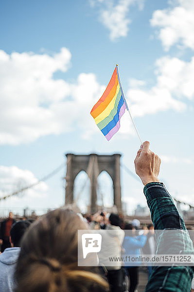 Woman waving LGBT flag in NYC  USA