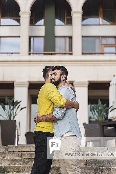 Hugging gay couple
