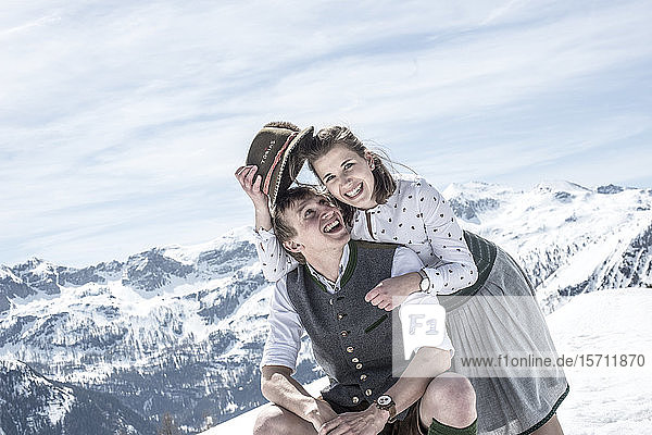 Happy couple in the snowy mountains  Salzburg State  Austria