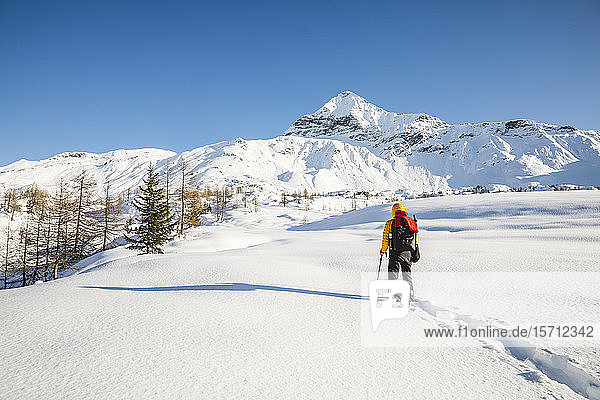Hiking with snowshoes in the mountains  Valmalenco  Sondrio  Italy