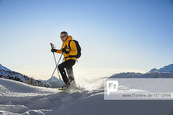 Hiking with snowshoes in the mountains  Valmalenco  Sondrio  Italy