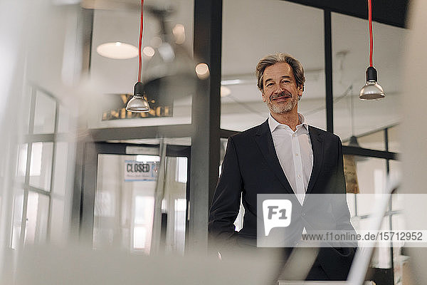 Portait of confident senior businessman in office