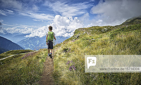 Boy hiking in alpine scenery  Passeier Valley  South Tyrol  Italy