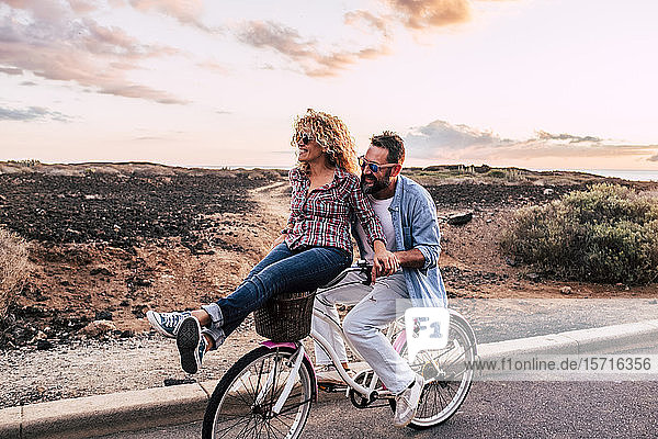 Smiling couple on bicycle  Tenerife  Spain