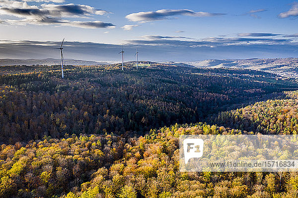 Germany  Baden Wurttemberg  Rems-Murr-Kreis  Aerial view of wind turbines and forest in Autumn
