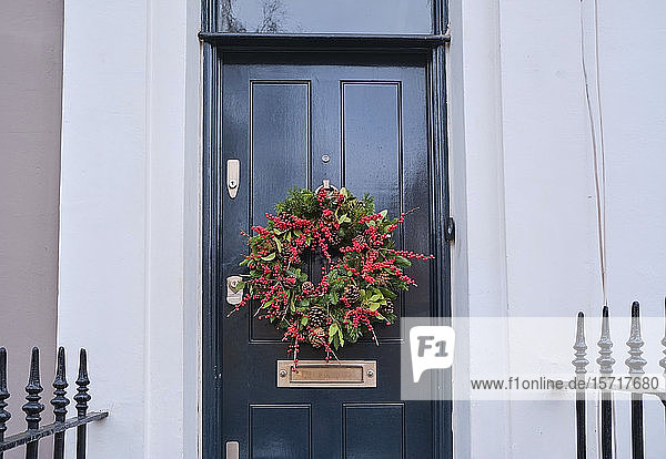 UK  England  London  Christmas wreath hanging on house entrance door