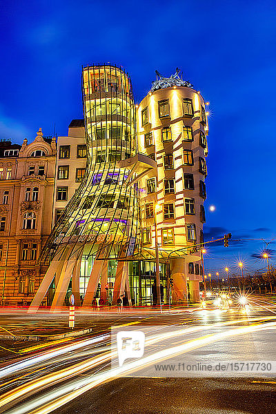 Czech Republic  Prague  Vehicle light trails in front of Dancing House at dusk