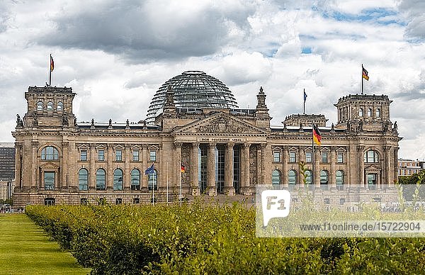 German flag flying next to the Reichstag or German parliament building  Regierungsviertel or government quarter  Berlin  Germany  Europe