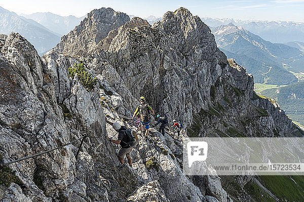 Mountaineer on a secured fixed rope route  Mittenwald via ferrata  Karwendel Mountains  Mittenwald  Germany  Europe