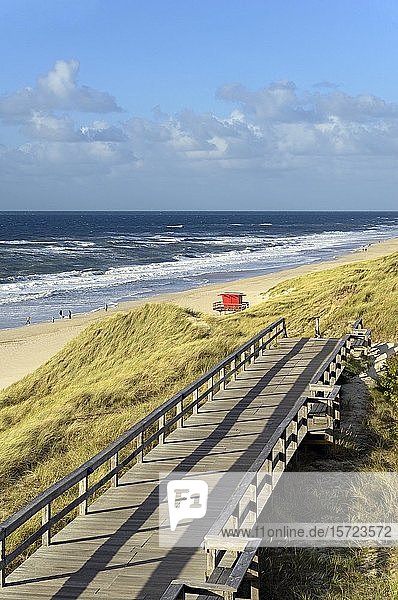 Boarded footpath leads through the dunes  red rescue tower on the beach  Wenningstedt  Sylt  North Frisian Island  North Sea  North Frisia  Schleswig-Holstein  Germany  Europe