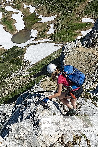 Young woman climbing  via ferrata  5 summit via ferrata  hike on the Rofan Mountains  Tyrol  Austria  Europe