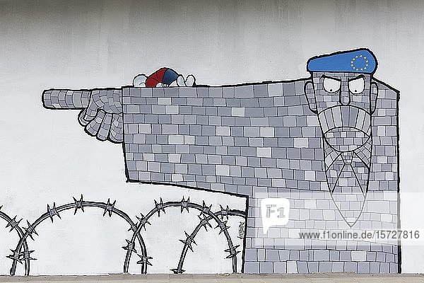 EU rejects refugees at the border  barbed wire and dead refugee child  symbolic mural by painter George Koftis  Streetart  40 Grad Urban Art Festival  Düsseldorf  North Rhine-Westphalia  Germany  Europe