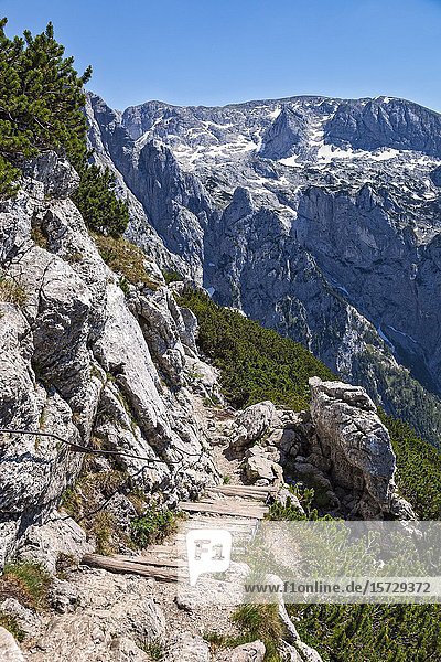 A rough mountain path leads towards Obersalzberg and the Austrian Border from the Gipfel Kehlstein viewpoint at the Eagle's Nest - Das Kehlsteinhaus  Mitterbach  Berchtesgaden  Bavaria  Germany.