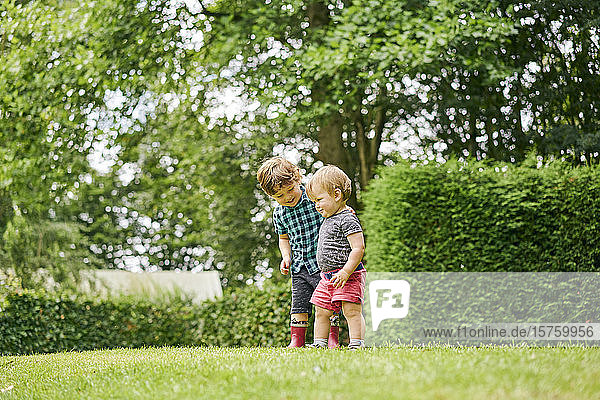 Toddlers exploring park