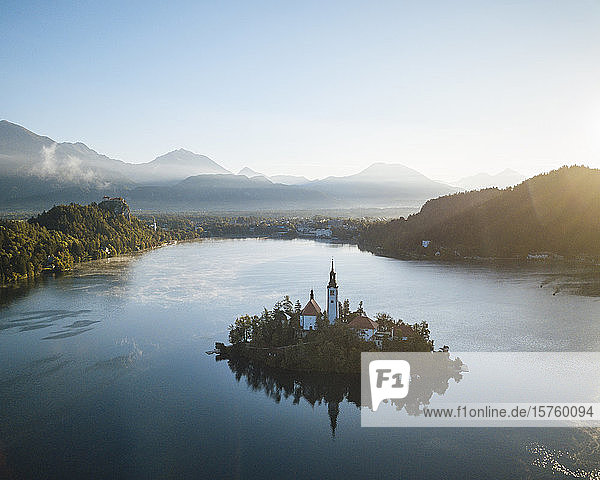 Aerial view of Bled Island with Church of the Assumption at dawn  Lake Bled  Upper Carniola  Slovenia