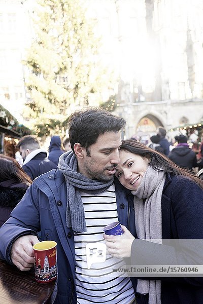 Couple with Glühwein at christmas market in Munich  Germany.