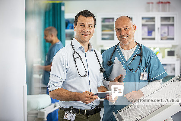 Portrait confident male doctors in hospital