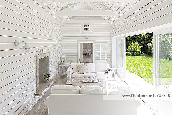 White wood shiplap a-frame home showcase sunroom