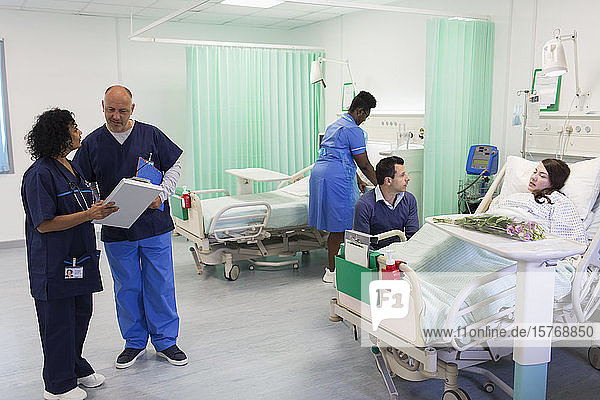 Doctors  nurse and patient in hospital ward