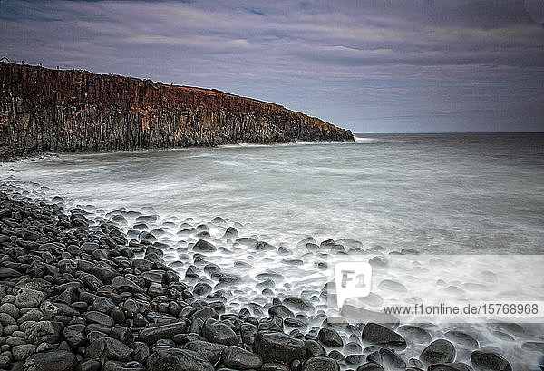 Rocks on remote ocean beach Cullernose Point Craster Northumberland UK