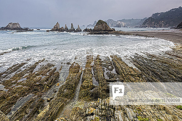 Tranquil rocky ocean beach Gueira Beach Asturias Spain