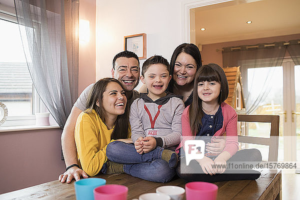 Portrait happy family with Down Syndrome child