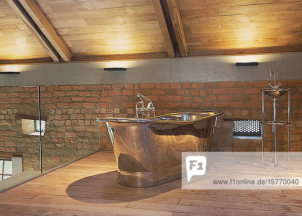 Home showcase interior stainless steel bathtub in loft bathroom