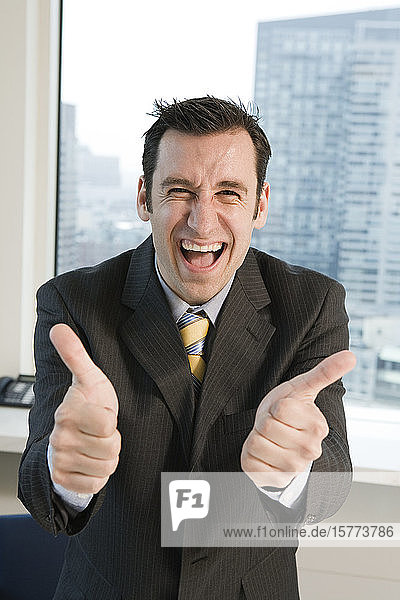 Portrait of a businessman smiling in an office.