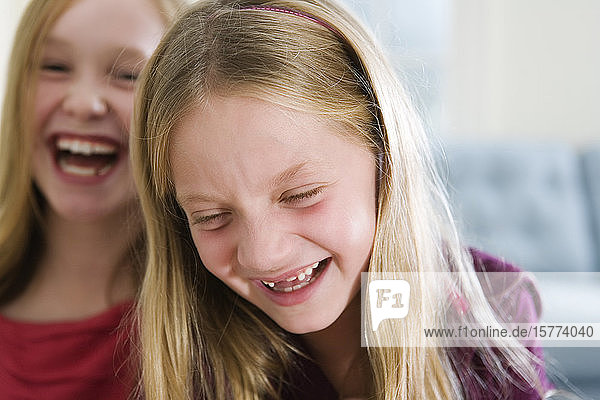 View of two girls laughing.